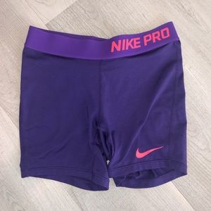 purple and pink youth nike pros